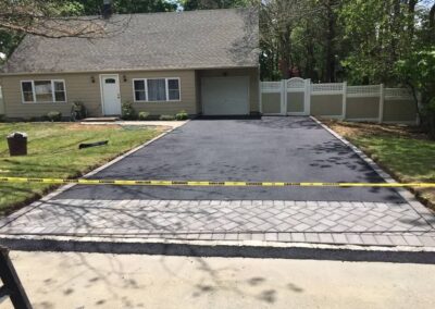 newley paved driveway with paver apron installed